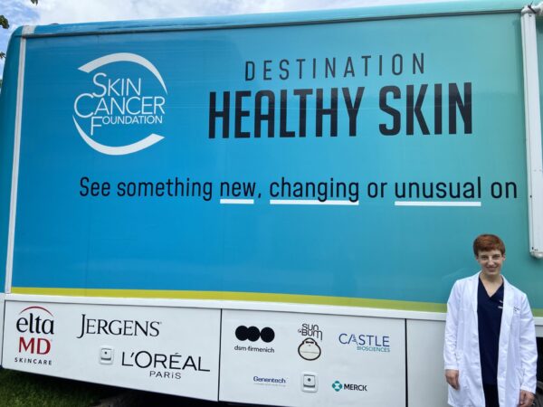 Eloise Galligan, MD, poses in front of the RV during a break in Minneapolis